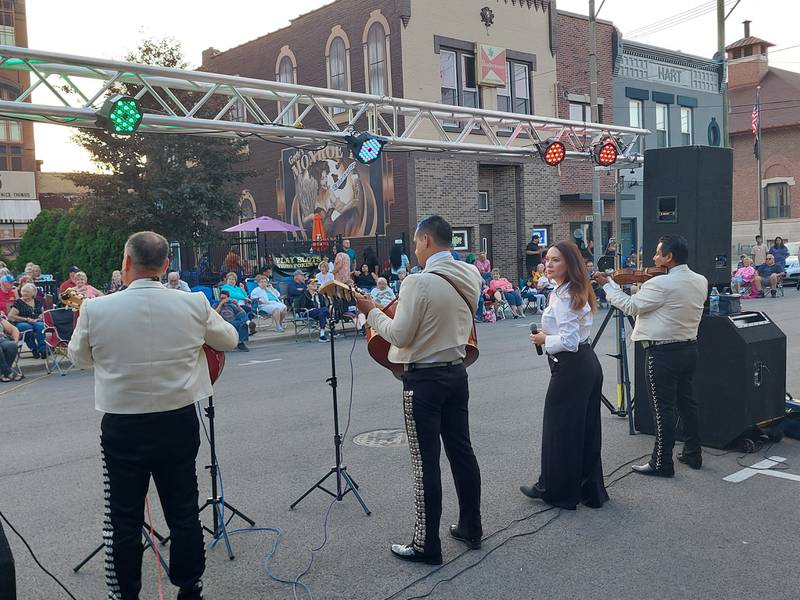 Tecalitan y Nora perform Friday, July 26, 2024, during the Jammin' at the Clock on Monroe Street along Heritage Park in Streator.