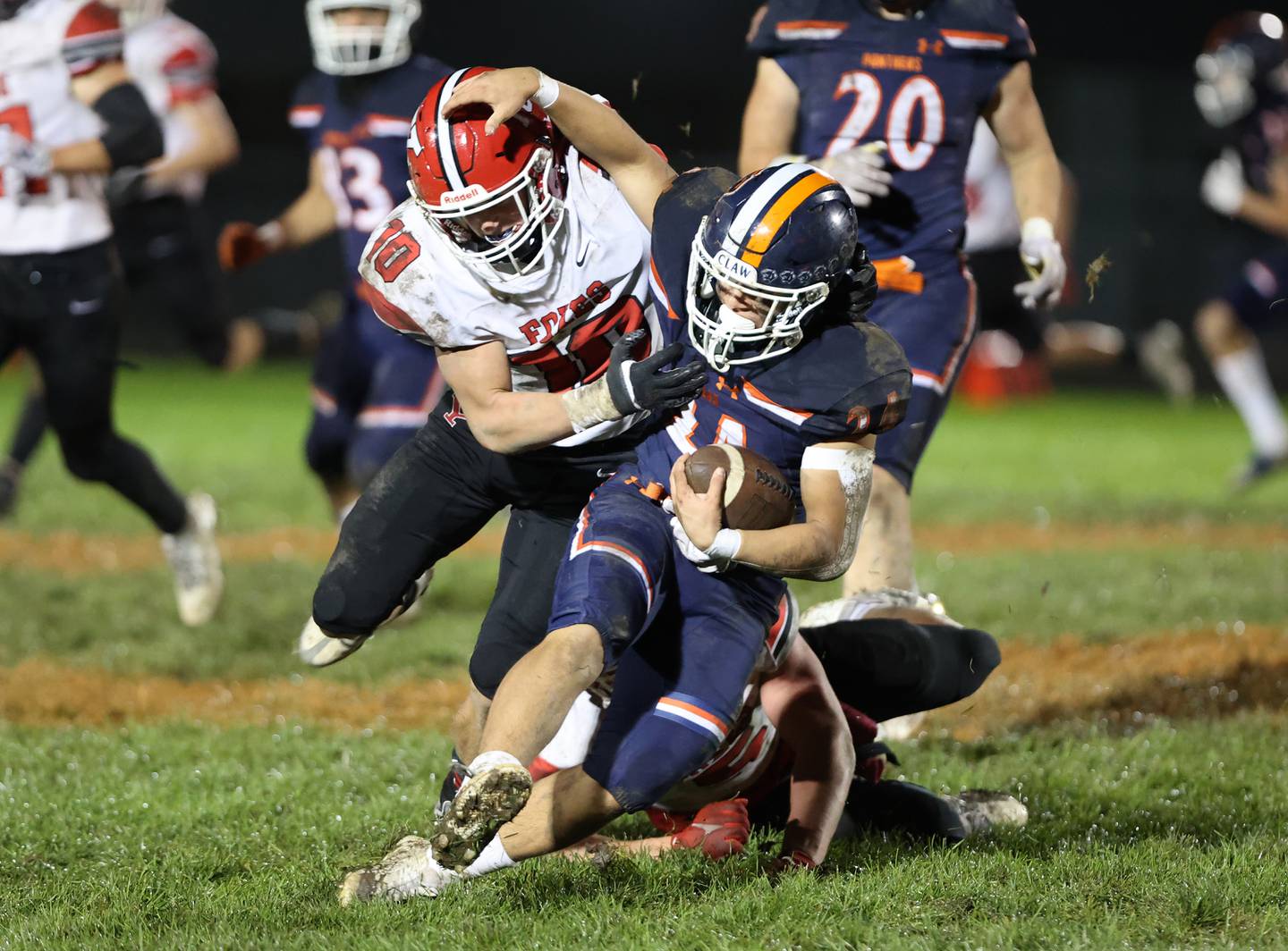 Oswego’s Ayden Villa (24) is tackled by Yorkville’s Luke Zook (10) during the boys varsity football game on Friday, Oct. 6, 2023 in Oswego.