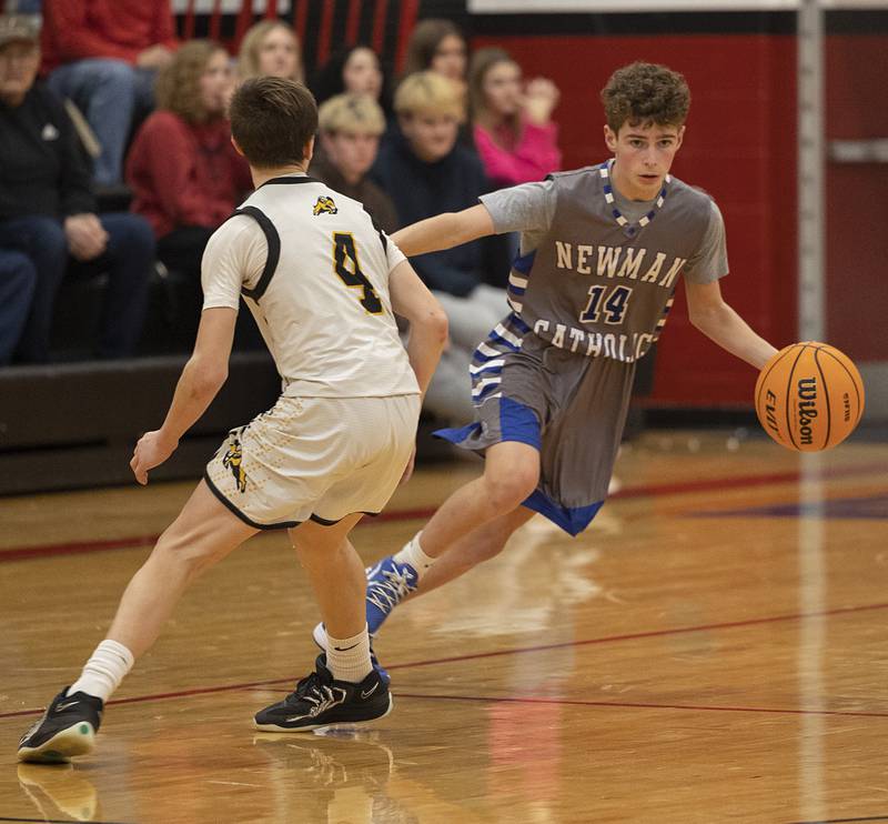 Newman’s Easton Coward brings the ball up court against Riverdale Tuesday, Dec. 30, 2025, in the final of the boys Cliff Warkins Basketball Tournament at Erie High School.