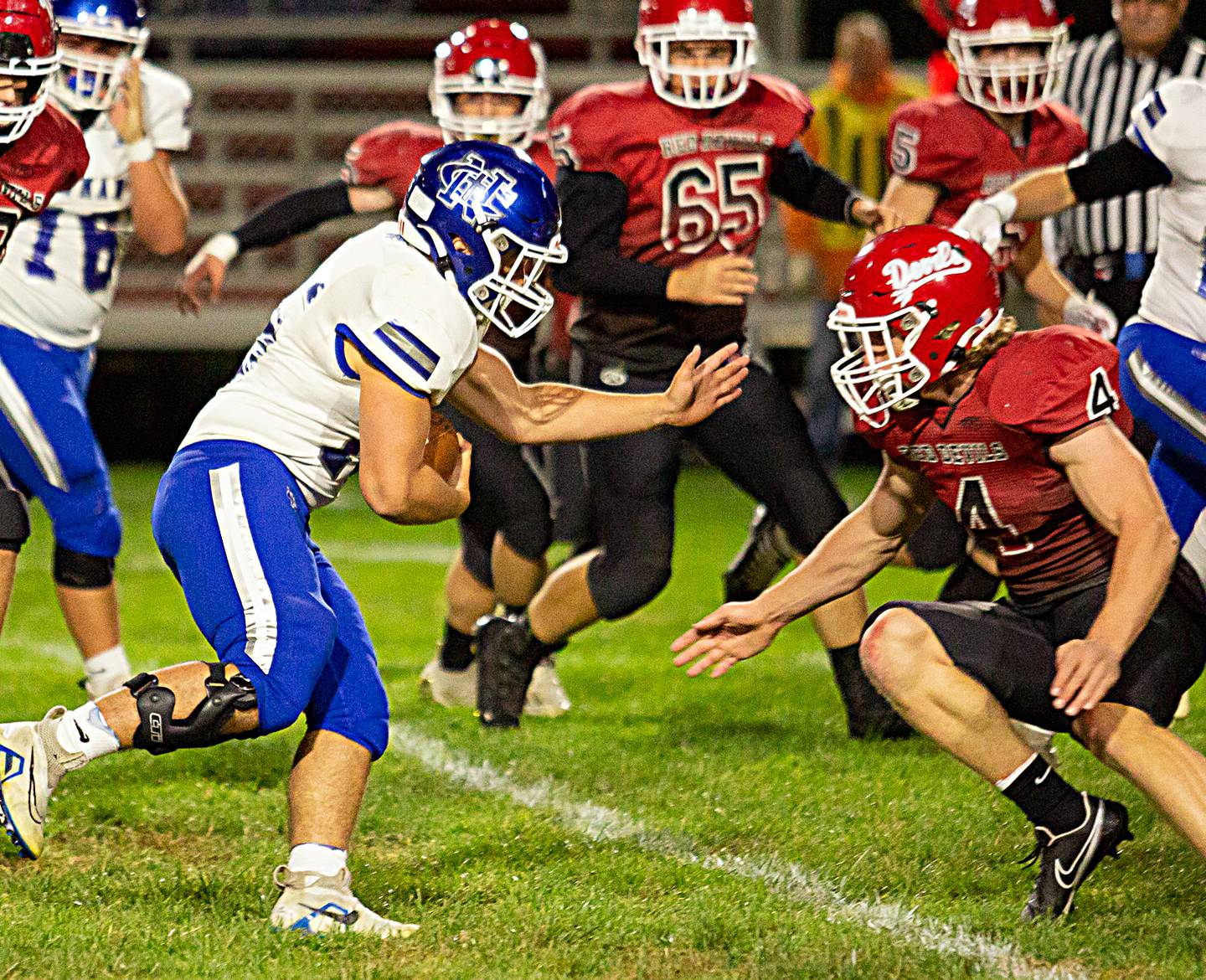 Newman's running back Hunter Luyando (15) carries the ball as Hall's Mac Resetich (4) looks to make a tackle on Friday, Oct. 7, 2022 at Richard Nesti Stadium.