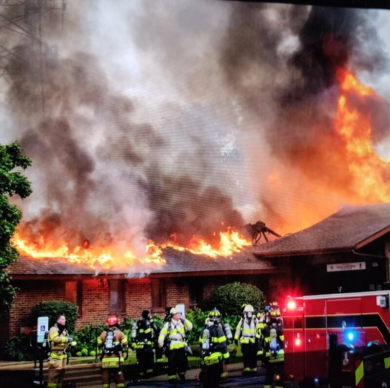 Firefighters prepare to battle a July 29 fire that partially destroyed Good Shepherd Lutheran Church and Academy in Downers Grove. Clean up has begun and church leaders hope reconstruction is complete in one year.