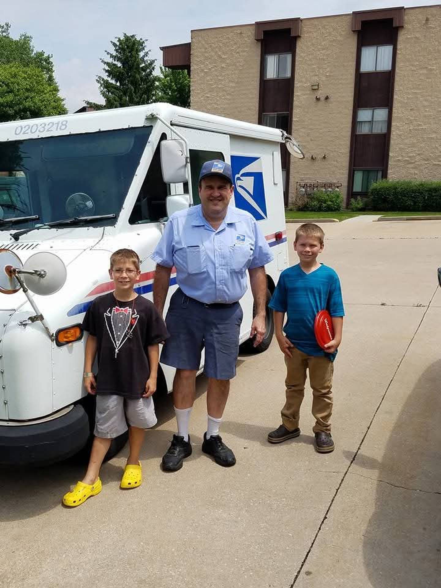 Mike Maloney of Diamond is seen with his grandsons Seth and Noah in 2014. Maloney retired from the United States Postal Service in November 2024 after nearly 42 years of service.