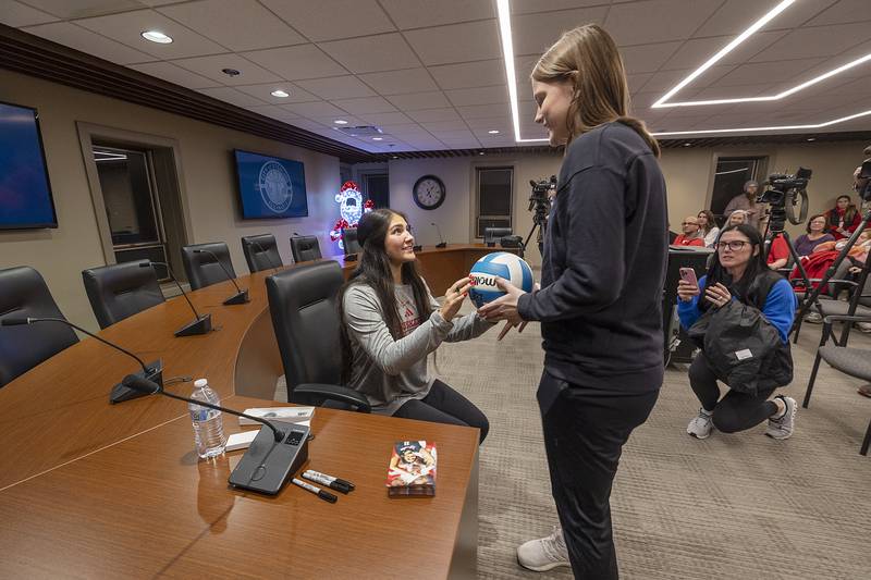 Kolbi Lawson, 13, of Sterling gets Lexi Rodriguez’s autograph Monday, Dec. 23, 2024, during a ceremony to celebrate the standout volleyball star.