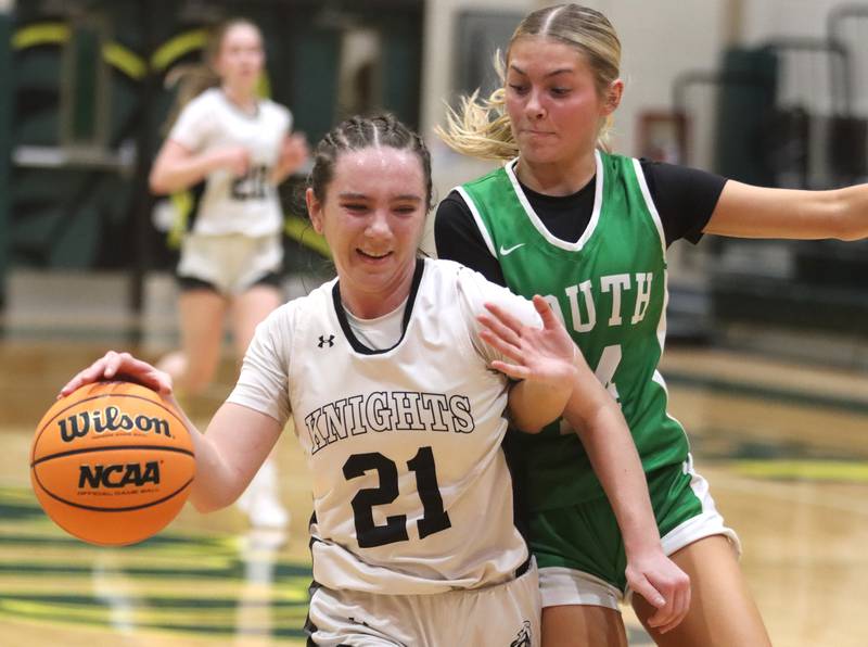 Crystal Lake South’s Makena Cleary, right, challenges Kaneland’s Kyra Lilly in IHSA Class 3A Regional Title Game girls basketball action on Friday, Feb. 21, 2025, at Crystal Lake South High School in Crystal Lake.