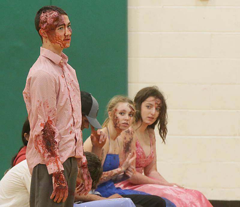 Alex Todd a student at Leland High School, speaks to classmates on his experience after participating in a Mock Prom drill at Leland High School on Friday, May 6, 2022 in Leland.