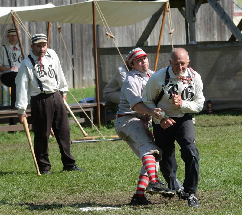 Ganymede catcher Tom Lasniak tags out a Rochester Grainger on Sunday, Aug. 13, 2023 at the 20th Annual World Tournament of Historic Base Ball.