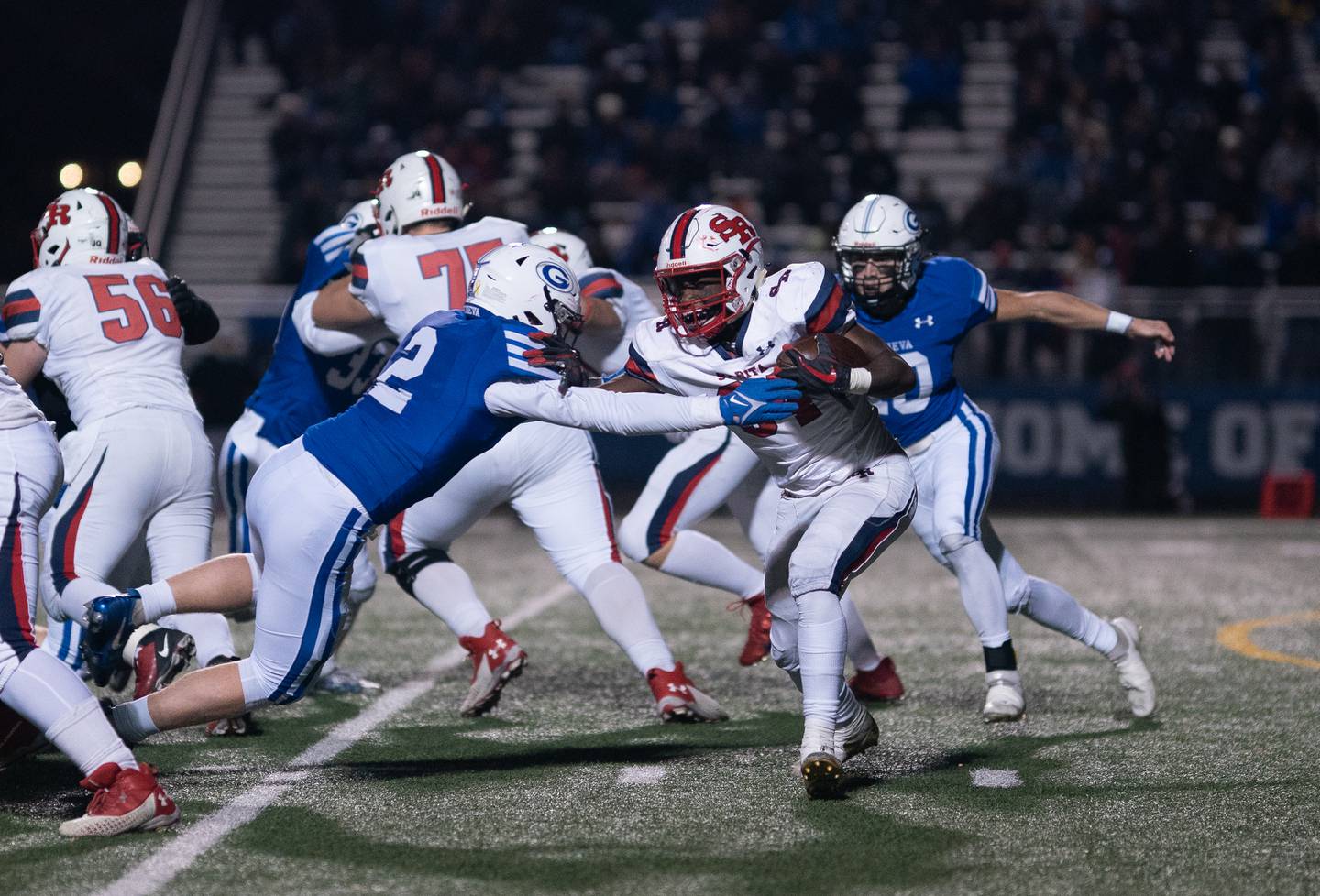 St. Rita's Ethan Middleton (84) carries the ball against Geneva during a 7A state football playoff game at Geneva High School on Friday, Nov 5, 2021.