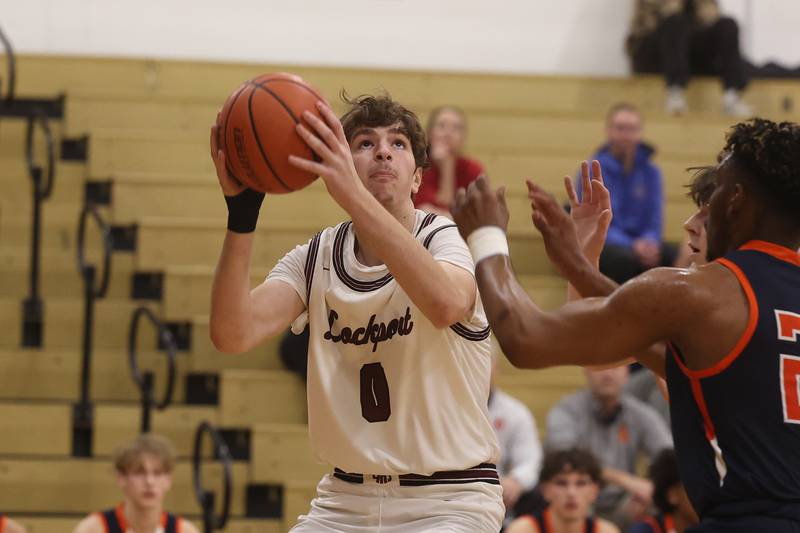 Lockport’s Hyatt Timosciek looks to take a shot from the paint against Oswego.