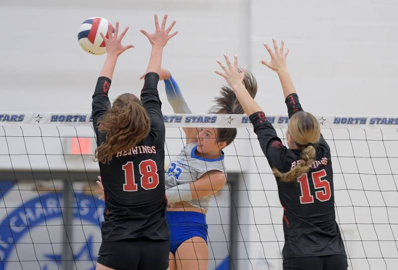 St. Charles North's Haley Burgdorf (23) fires a shot past Benet’s Sophia Pursley (18) and Sophia Chinetti (15) during a game on Wednesday, September 20, 2023.