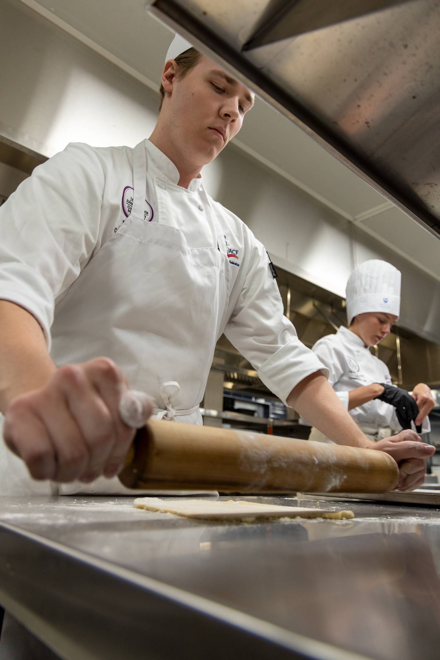 Joliet Junior College culinary arts program.  taken in 2023 of our then-student competition team during a practice. JJC PR said: I think they illustrate the action and dynamics of the training kitchens at City Center campus.