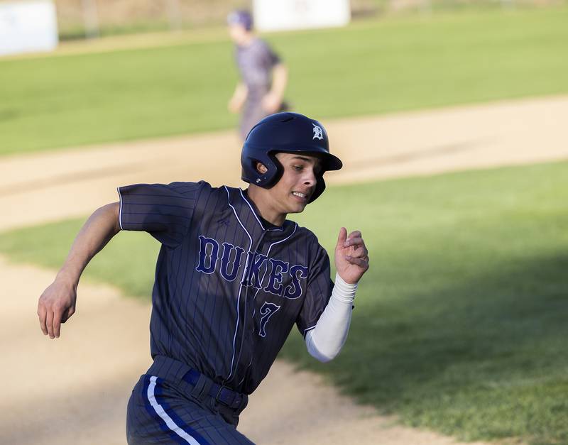 Dixon’s Eli Kirchoff rounds third to score against Rock Falls Tuesday, April 29, 2025.
