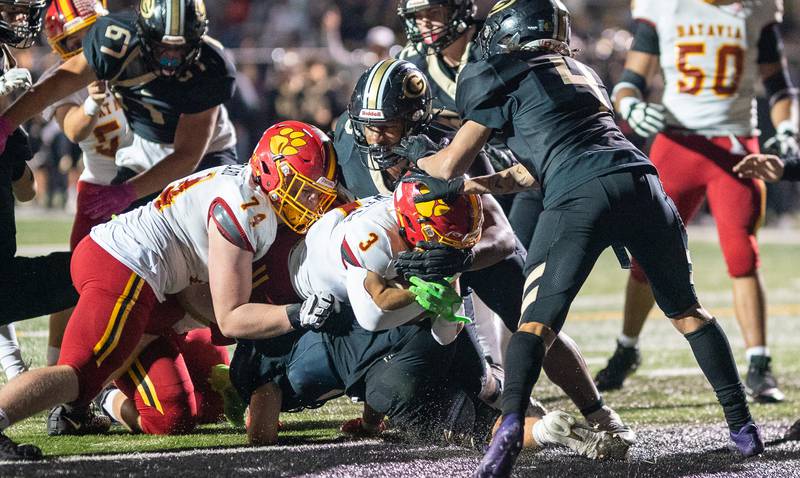 Batavia's Ryan Whitwell (3) dives in for a touchdown against Glenbard North during a football game at Glenbard North High School in Carol Stream on Friday, Sep 23, 2022.