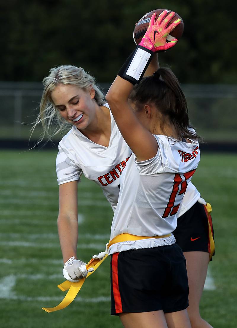 Crystal Lake Central's Ruby Macke pulls her teammates, Emma Sieg flags as Crystal Lake Central celebrates Sieg’s touchdown during a girls flag football game against Prairie Ridge on Thursday, Sept. 4, 2025, at Prairie Ridge High School in Crystal Lake.