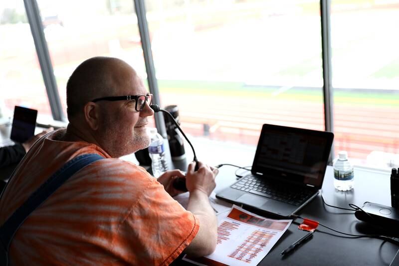 St. Charles East teacher Neil Currie announces a recent girls soccer game from the press box.