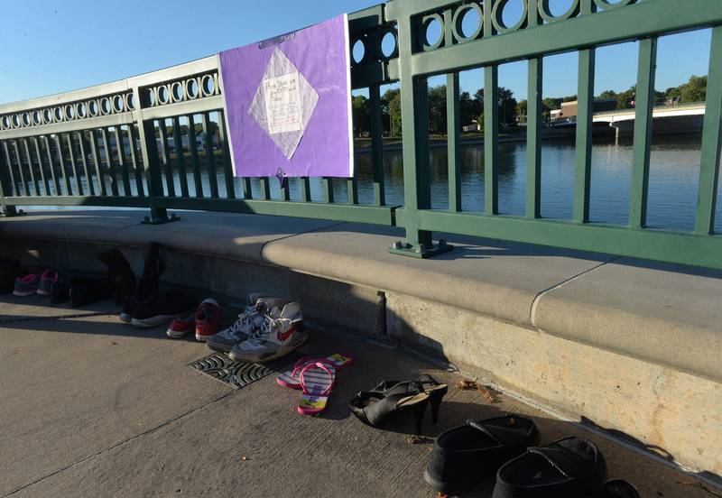 Ten pairs of empty shoes were displayed at the Sauk Valley Voices of Recovery Overdose Awareness event in Dixon on Thursday, Aug. 31, 2023 to show that at least 10 people are lost to overdose every day in Illinois.