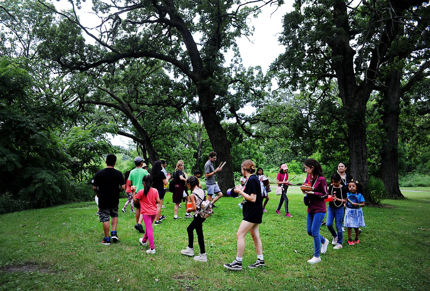 Children from the Youth and Family Center of McHenry County summer camp program participate in a drum circle Wednesday, July 6, 2022, during a field trip to the Harrison Benwell Conservation Area, 7055 McCullom Lake Road in Wonder Lake. The Youth and Family Center of McHenry County is hiring a social worker to assist with the mental health needs of those they help. The nonprofit is one of three receiving funds through United Way of Greater McHenry County as part of an Advance McHenry County grant.