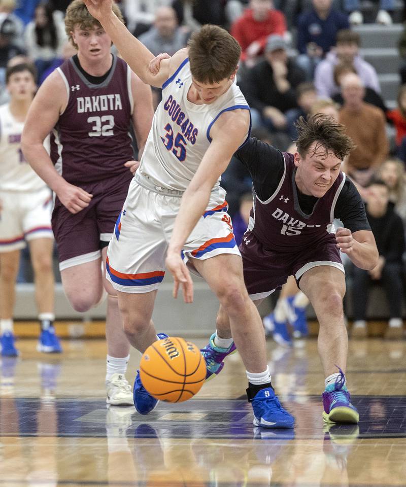 Eastland’s Parker Krogman is fouled by by Dakota’s Brody Keeney Wednesday, March 5, 2025, during the Class 1A boys basketball Sectional semifinal at Pecatonica High School.
