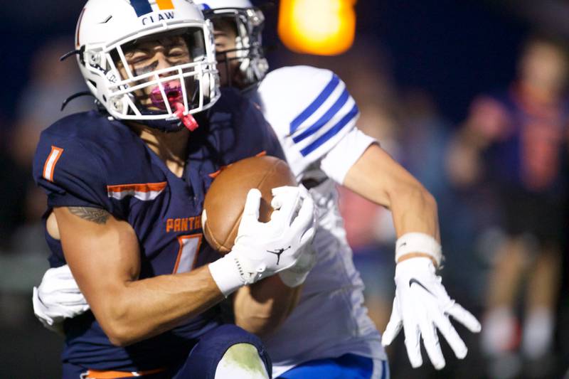 Oswego's Teddy Mankas runs the ball against Geneva on Friday, Sept. 5, 2025 in Oswego.