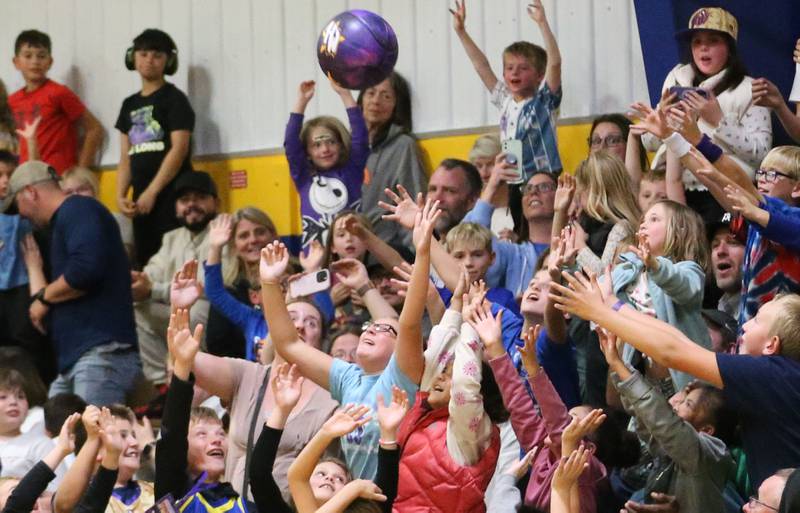 Kids reach up to try to catch a basketball as it is tossed into the crowd during the Harlem Wizards event on Tuesday, Oct. 28, 2025 in Pannebaker Gymnasium at Logan Jr. High School in Princeton.