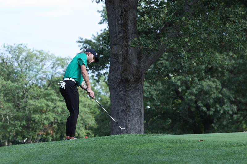 Bishop McNamara's Braylon Ricketts chips onto the green during the All-City matchup on Wednesday, Sept. 24, 2025. Ricketts would tie for second place with Bradley-Bourbonnais' Kaden Davis with a score of 84 to help the Fightin' Irish earn a 339-342 victory over the Boilermakers.