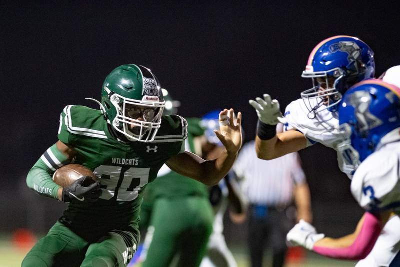 Plainfield Central's Torrance Freeman runs the ball during a game against Joliet Central on Friday Oct. 11, 2024 at Plainfield Central High School