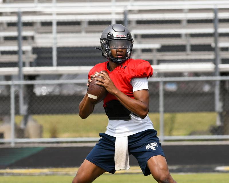 Tre Jones prepares to throw the ball during a pratice against Metea Valley on Thursday July 7th at Metea Valley.