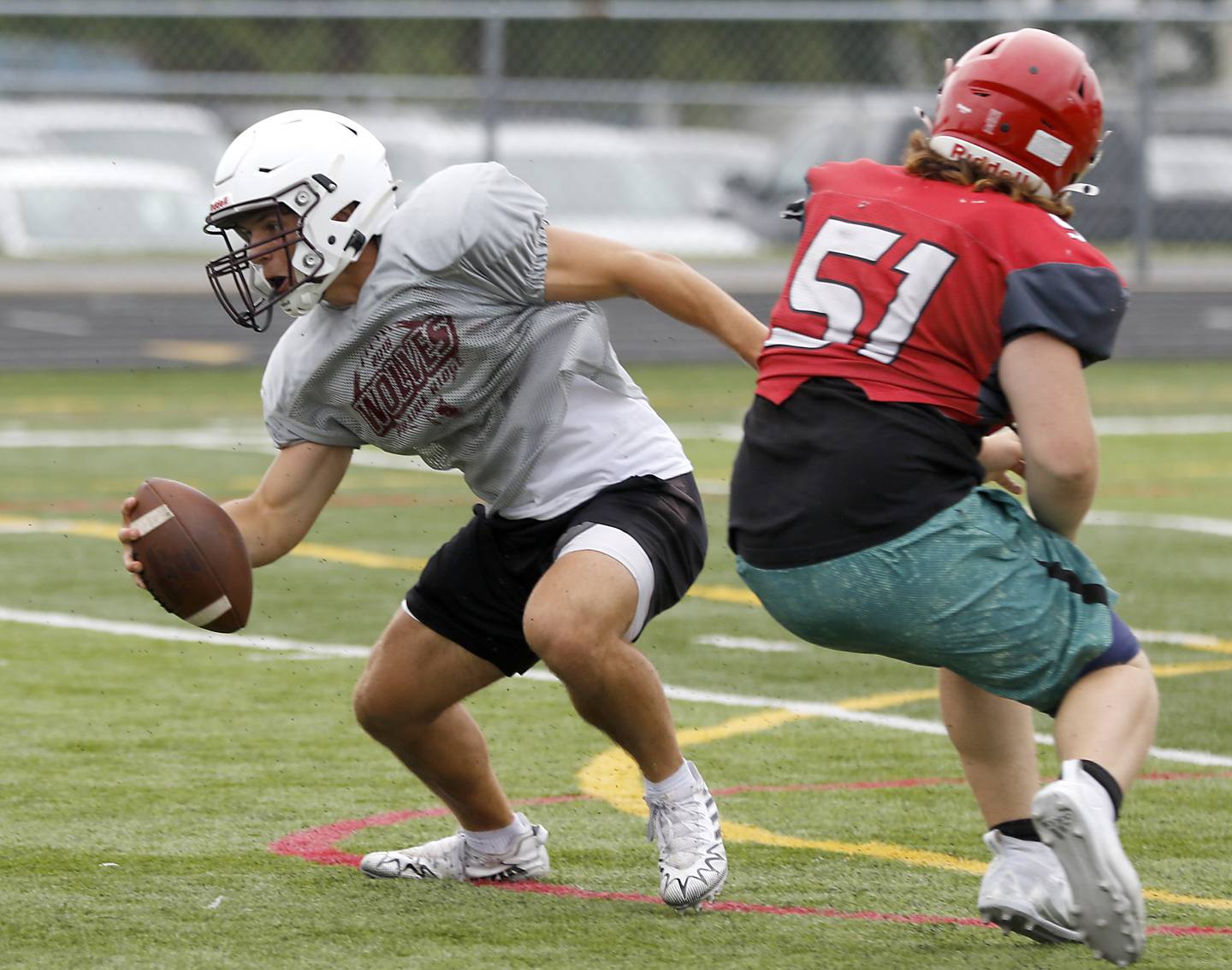 Prairie Ridge quarterback Luke Vanderwiel escapes the pass rush during football practice against Grant on Thursday, July 17, 2025, at Grant High School in Fox Lake.