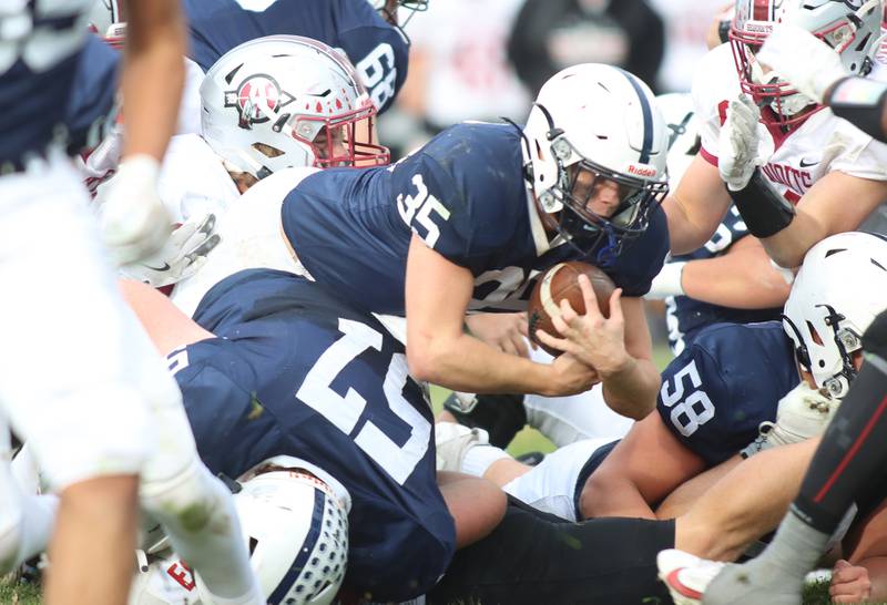 Cary-Grove’s Michael Massat breaks through for a first down against Antioch in IHSA Class 6A second-round playoff football action on Saturday, Nov. 9, 2024, at Al Bohrer Field on the campus of Cary-Grove High School in Cary..