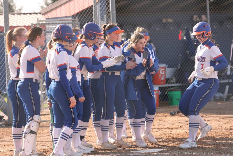 Genoa-Kingston players wait to congratulate Elizabeth Davis after she homered during their game against Stillman Valley Tuesday, April 18, 2023, at Genoa-Kingston High School.