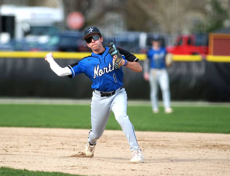 St. Charles North's Nolan Macholz throws to first during a game against Batavia on Thursday, April 24, 2025 in Batavia.