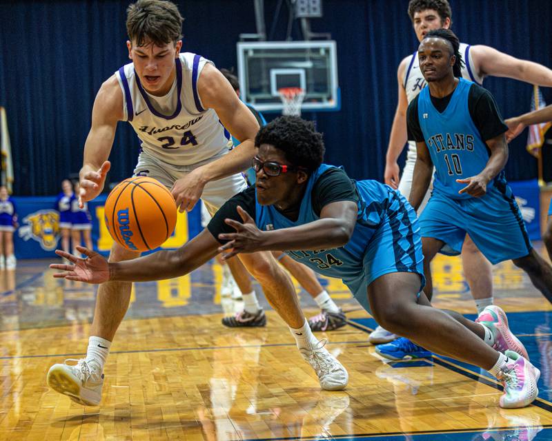 Lota Onwuameze (34) of IMSA dives for ball as Payton Twait (24) of Serena reaches in during the quarterfinals of the Little Ten Conference Tournament on Monday, Feb. 2, 2026 at Somonauk High School in Somonauk.