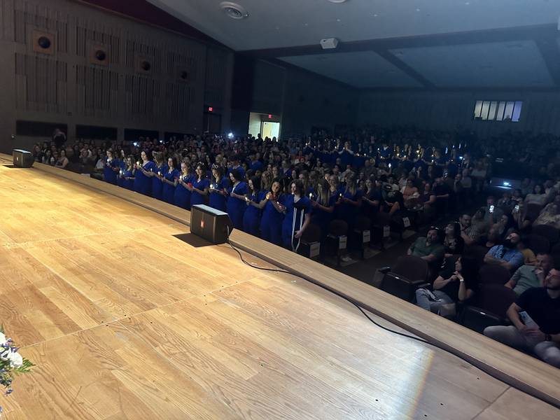 New CNAs receive their pins Wednesday evening in front of over 700 friends and family.