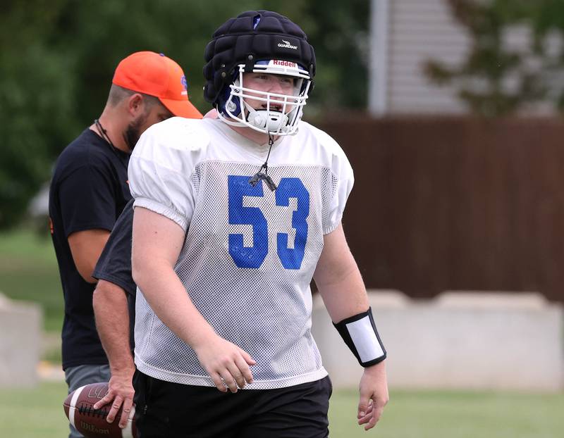 Genoa-Kingston’s Mason McPeek walks onto the field Tuesday, Aug. 19, 2025, during practice at the school.