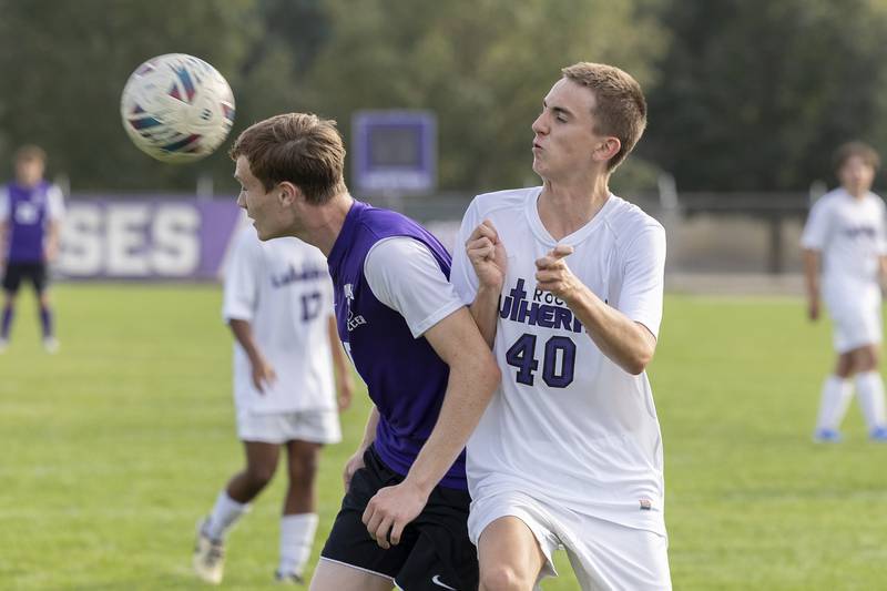 Dixon’s Logan Grett and Rockford Lutheran’s Kameron Keegan go for the ball Wednesday, Sept. 18, 2024.
