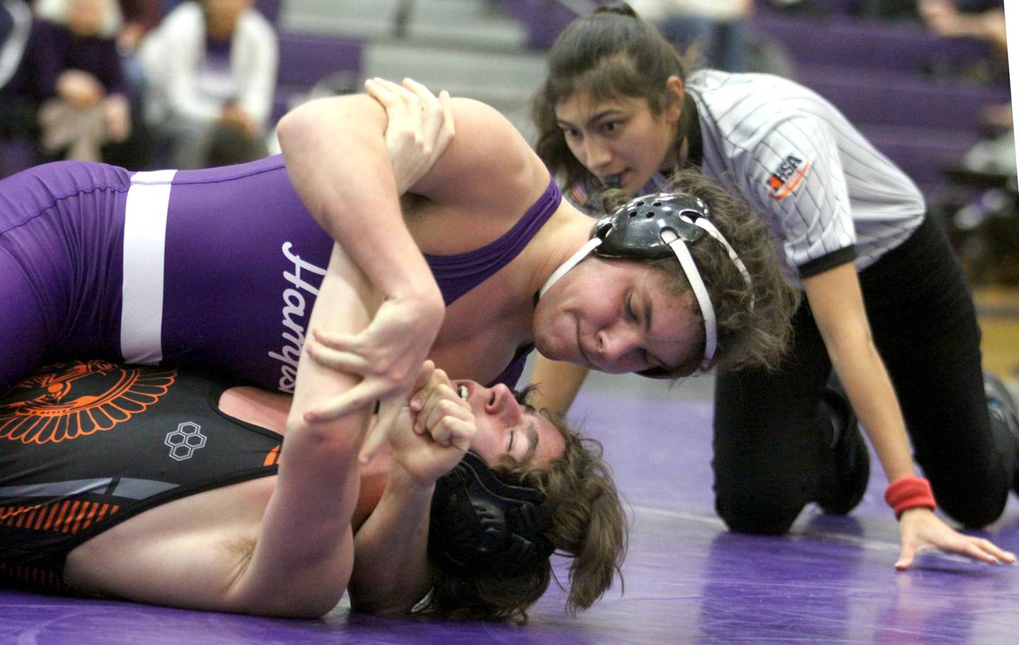 McHenry’s  Peyton Horowicz, bottom, is pinned by Hampshire’s Dimitri Skoulikaris at 182 pounds in varsity wrestling Thursday at Hampshire.
