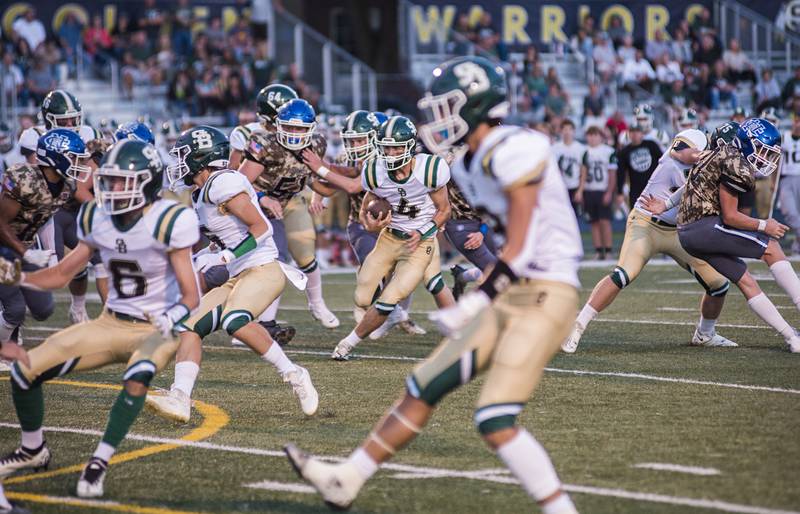 St. Bede’s John Brady picks up yards against Newman Friday, Sept. 16, 2022.