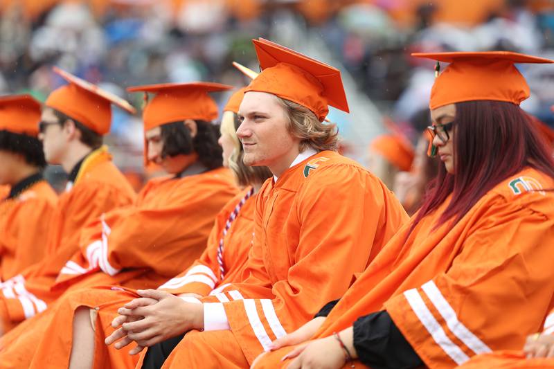 Bryce Atkin sits in attendance on Plainfield East’s Class of 2022 graduation. Saturday, May 21 2022, in Plainfield.