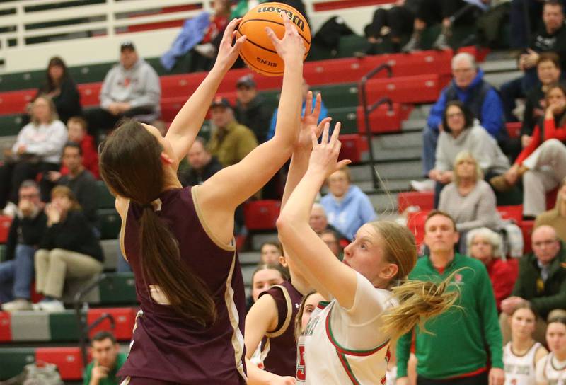 Morris's Lily Hensen grabs a rebound over L-P's Margaret Boudreau on Monday, Feb. 9, 2026 in Sellett Gymnasium at L-P High School.