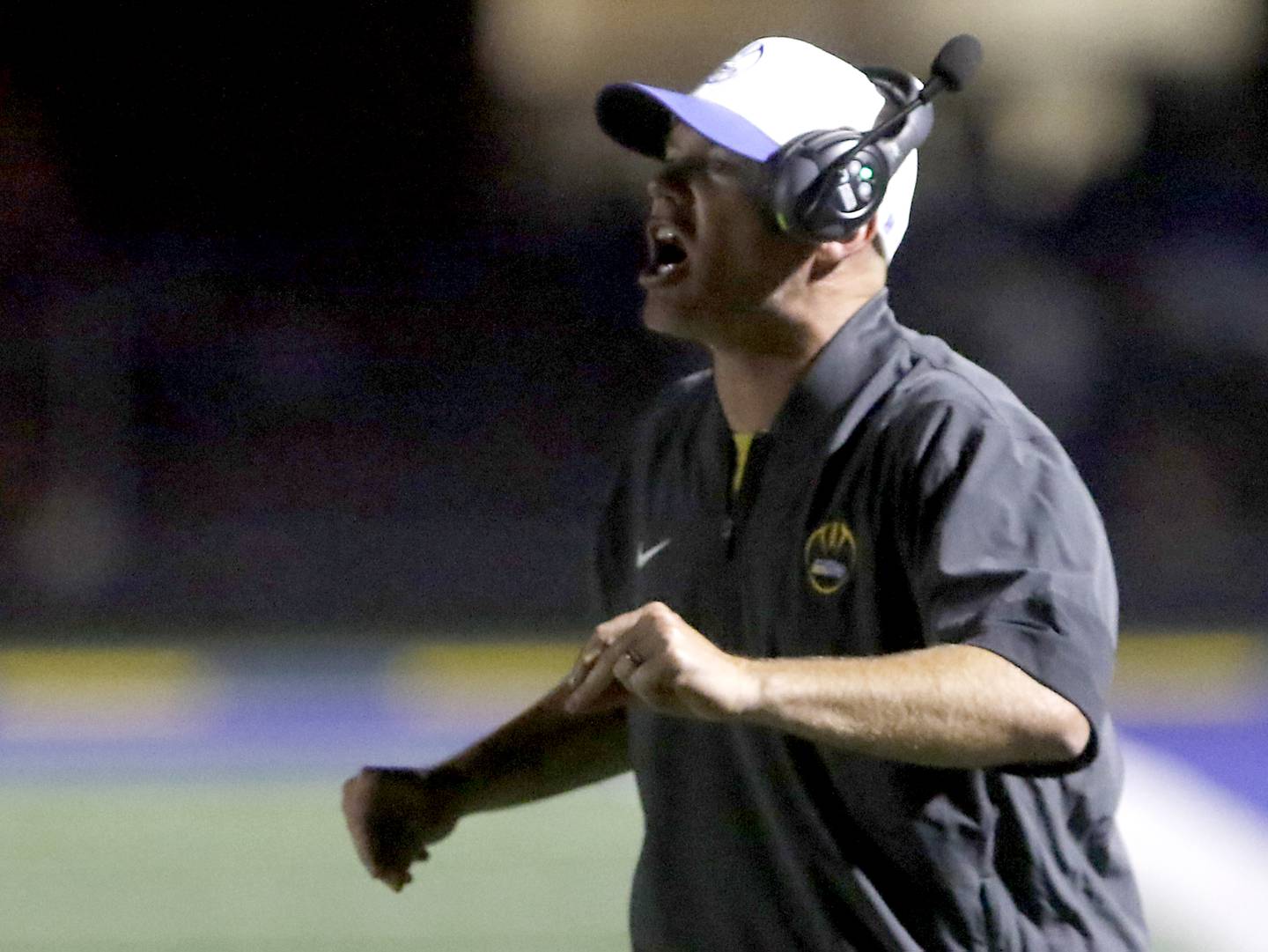 Johnsburg Head Coach Sam Lesniak yells at his team during a Kishwaukee River Conference football game against Richmond-Burton on Friday, Sept. 12, 2025, at Johnsburg High School.