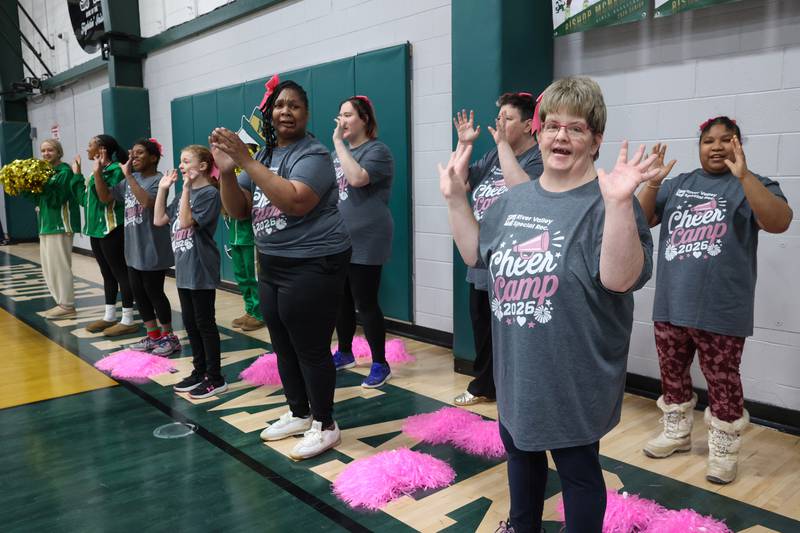 River Valley Special Rec cheerleader Shannon Archer, right, helps lead a cheer during River Valley's game against Lincolnway Special Recreation Association at Bishop McNamara on Friday, Jan. 30, 2026.