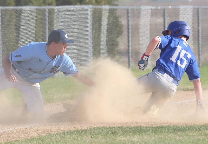Bureau Valley's Dylan Howlett fails to hang onto the ball as Newman's Liam Nicklaus slides safely into third base on Monday, March 30, 2026 at Bureau Valley High School.