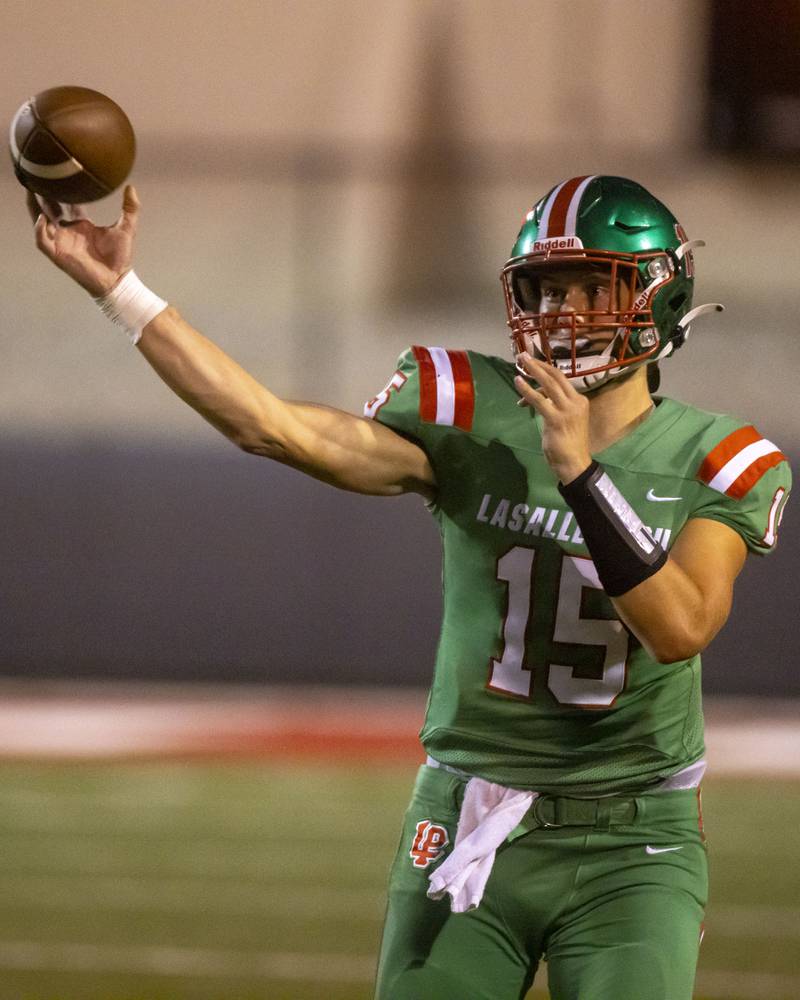 LaSalle Peru quarterback Brendan Boudreau attempts a pass to his receiver during a game against Woodstock North at Howard Fellows Stadium on Sept. 8, 2023.