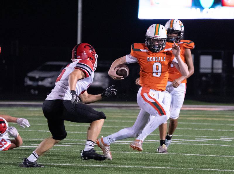 Plainfield East's Quinn Callaghan (9) runs on a keeper against Yorkville during a high school football game at Plainfield East High School in Plainfield on Friday, Sep 17, 2021.