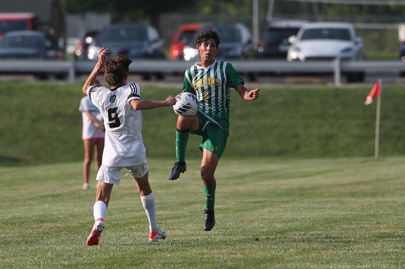 Providence’s Vincent Dinovo works the ball against Joliet Catholic on Aug. 21, 2023 in New Lenox.