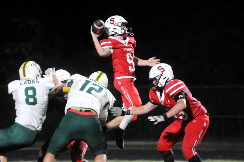 Streator quarterback Sam Lerette (9) attempts a pass as teammate Aiden Ferris covers him as Coal City's Donnie Ladas (8) and Emmett Easton apply pressure on Friday, Sept. 19, 2025 at Doug Dieken Stadium.