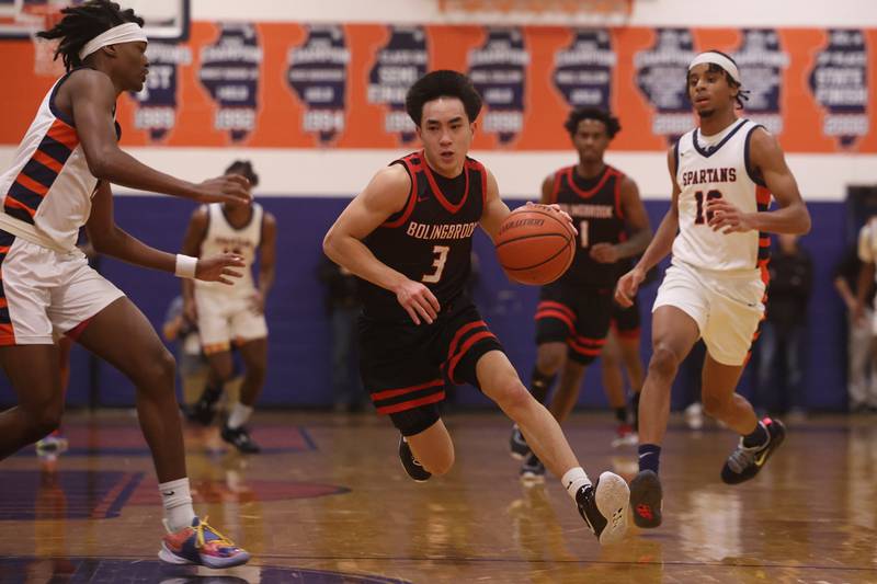 Bolingbrook’s Josh Aniceto makes a move to the paint against Romeoville.