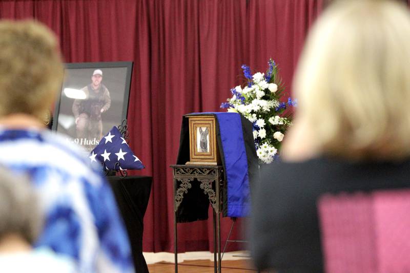 Members of the public file past the remains of Kane County Sheriff K9 Hudson during a funeral in honor of the Dutch shepherd, who lost his life in the line of duty last month, on Thursday, June 1, 2023 at Kaneland Harter Middle School in Sugar Grove.