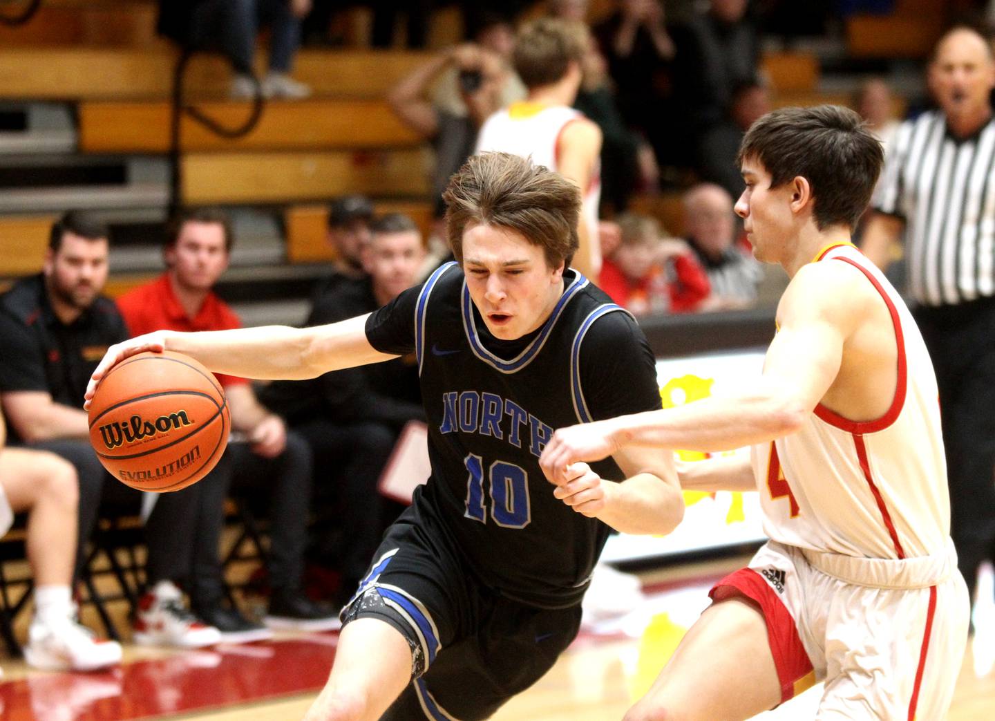 St. Charles North’s Danny Connolly (left) drives toward the basket during a game at Batavia on Wednesday, Jan. 11, 2023.