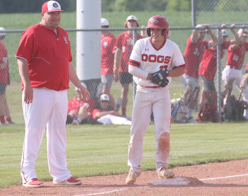 Streator head baseball coach Beau Albert smiles as player Parker Phillis reaches third base during the Class 3A Sectional semifinal game on Wednesday, May 31, 2023 at Metamora High School.