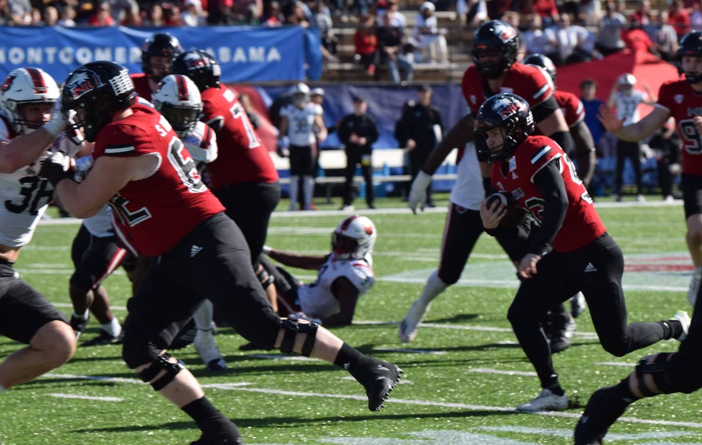 NIU kicker Kanon Woodill run for a touchdown on a fake field goal attempt in the Huskies' Camellia Bowl game against Arkansas State on Saturday, December 23, 2023.